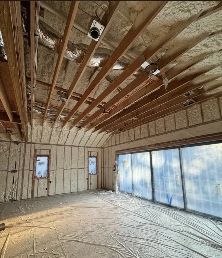 Interior walls and ceiling insulated with spray foam during new construction in Hickam Housing